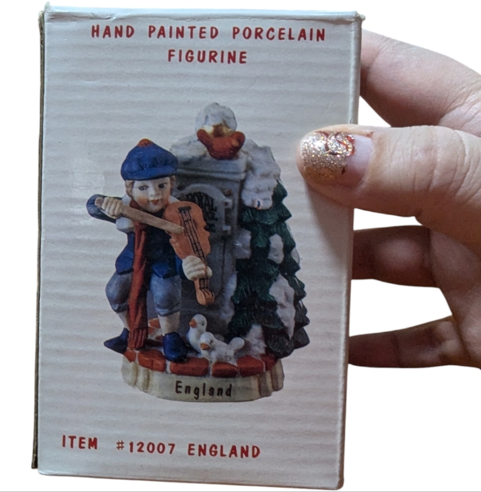 Children of the world Hand Painted Porcelain Figurine - England music